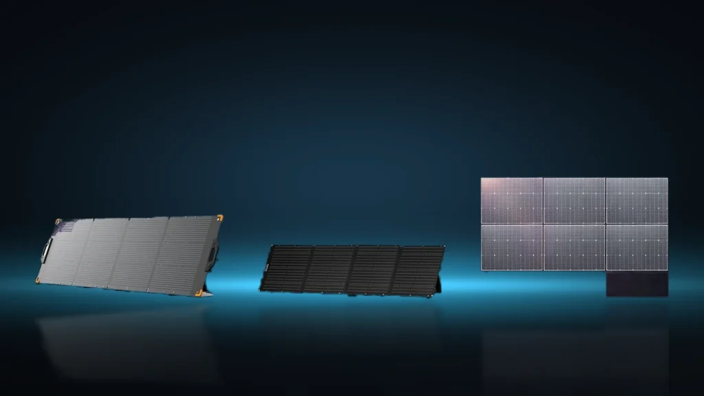Panel składany rozłożony obok przenośnej stacji zasilania podczas ładowania solarnego
